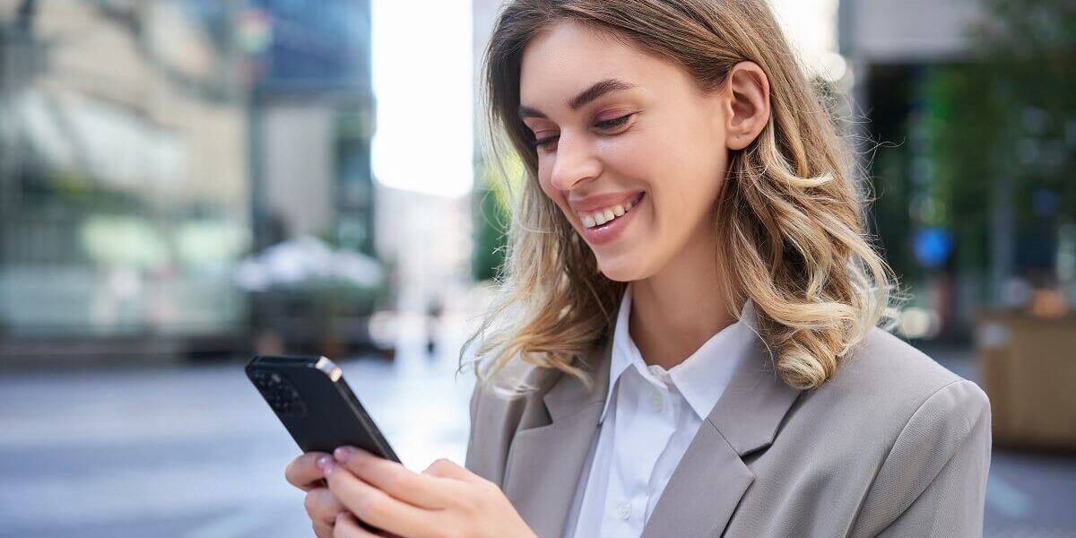 portrait-of-smiling-businesswoman-chat-in-app